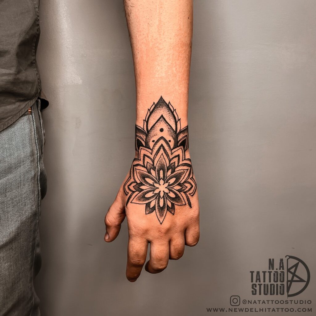 Bold Mandala Hand Tattoo with Dark Shading mandala wrist tattoo ideas tattoo