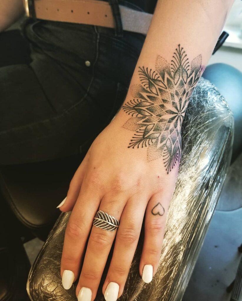 Bold Mandala Wrist and Hand Tattoo mandala wrist tattoo ideas tattoo