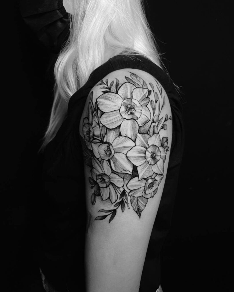 Bold Narcissus Shoulder Tattoo with Detailed Linework december birth flower tattoo ideas tattoo