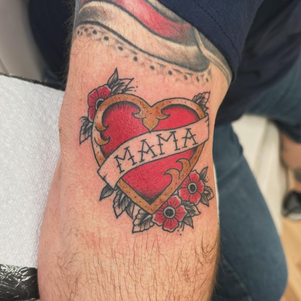 Bold Red Heart Encased in a Golden Border with Flowers memorial tattoos tattoo