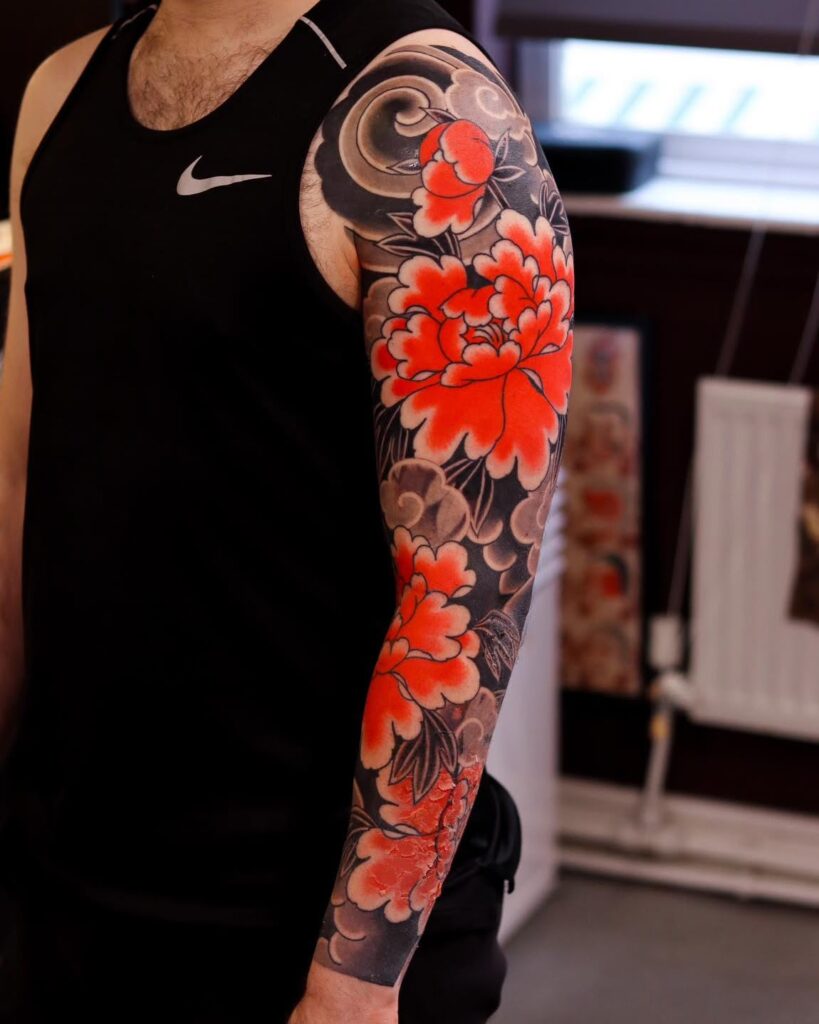 Bold Red Peonies and Blackout Sleeve japanese peony tattoos tattoo
