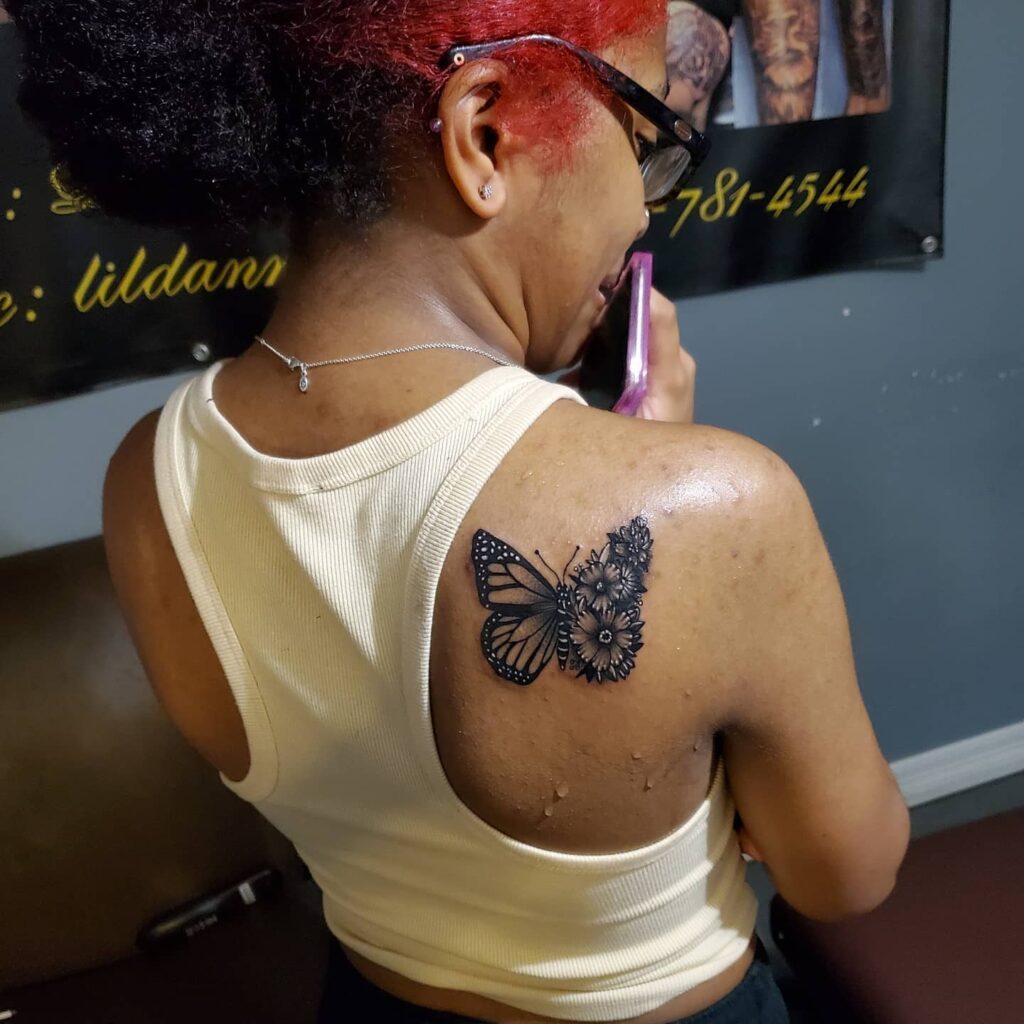 Bold Shoulder Butterfly and Flower Tattoo half butterfly half flower tattoos tattoo