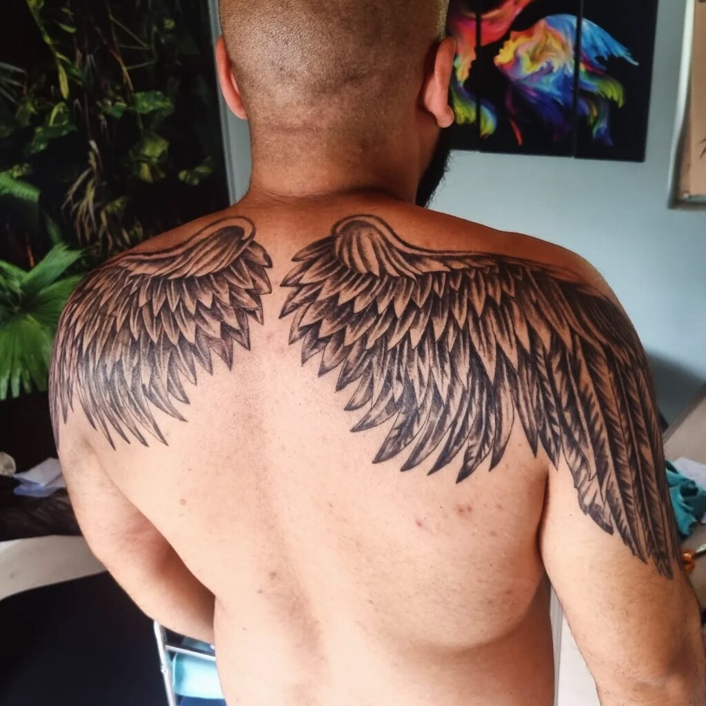 Bold Shoulder-Spanning Angel Wings Tattoo angel wings tattoo ideas tattoo