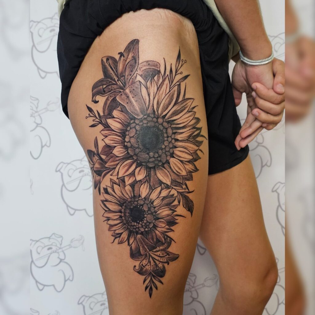 Bold Sunflower and Lily Thigh Tattoo sunflower tattoos tattoo