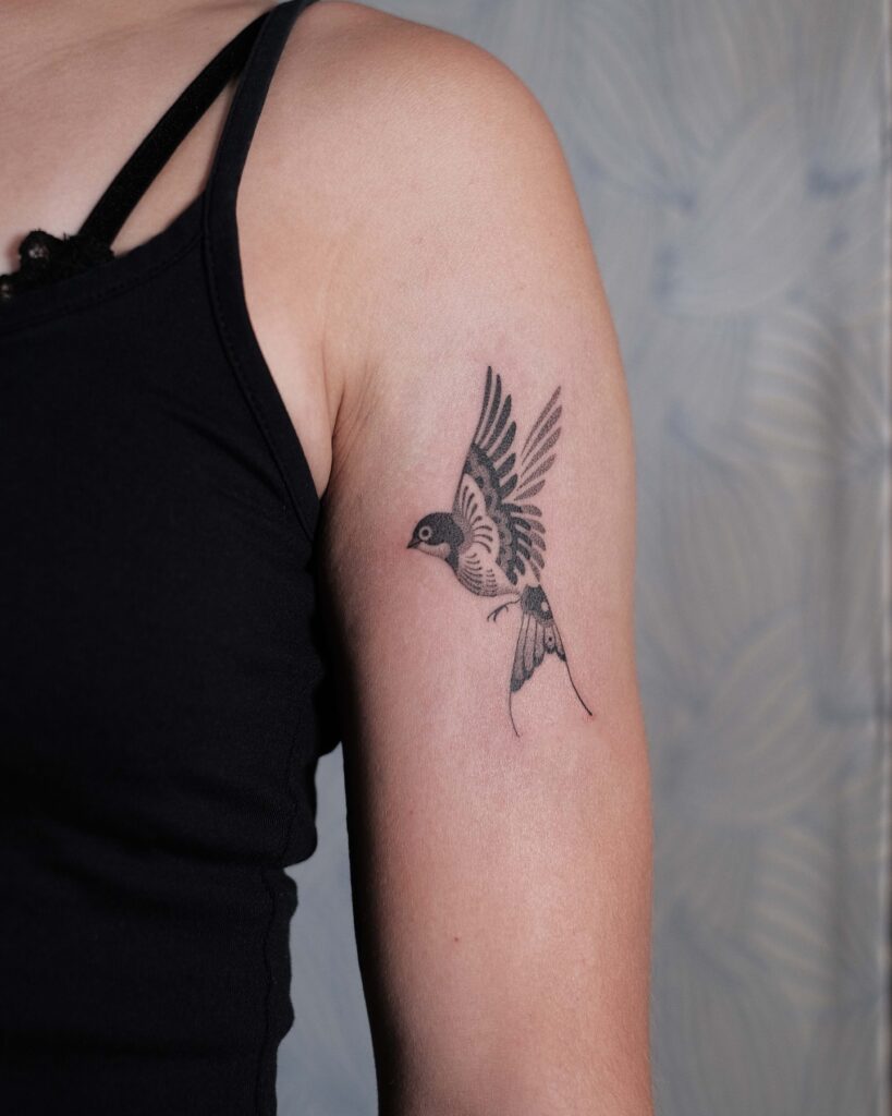 Bold Swallow-Inspired Arm Tattoo bird tattoo ideas for women with meaning tattoo