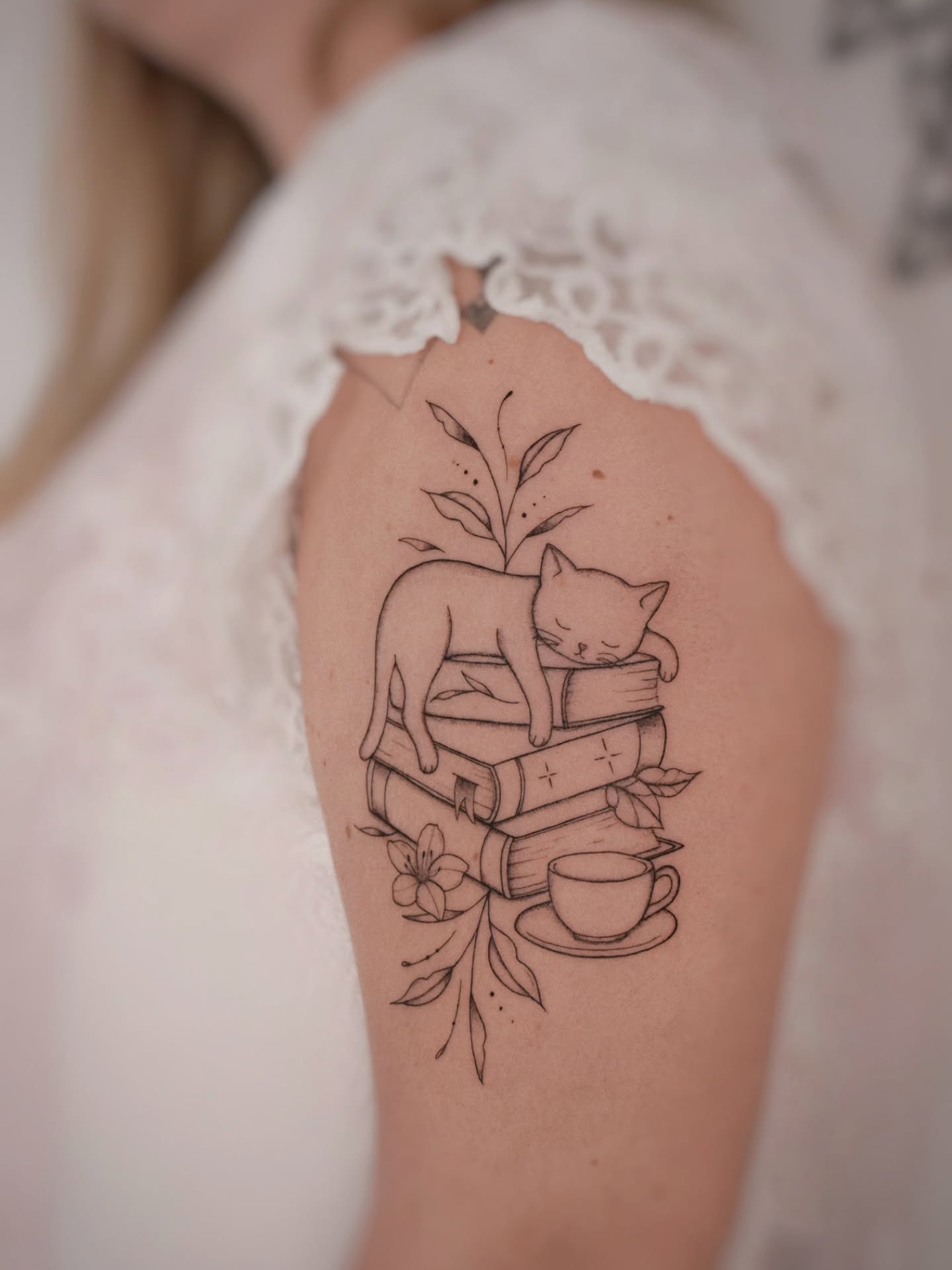 Sleeping Cat On Book Stack Tattoo