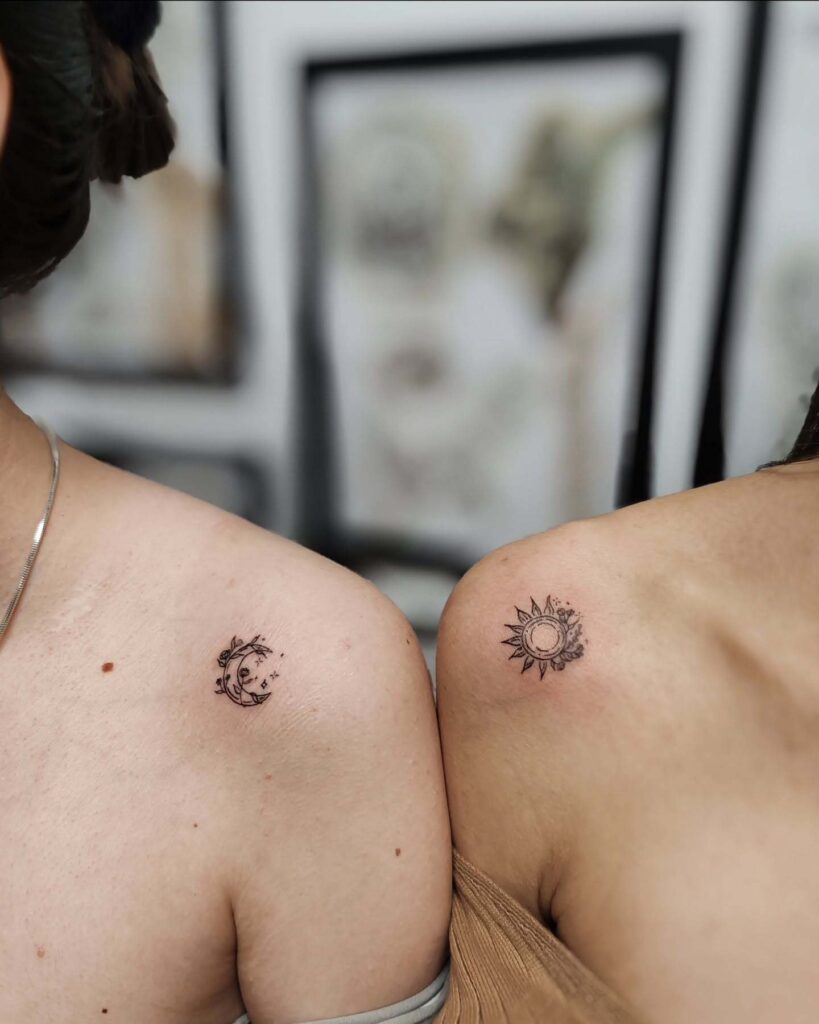 Floral sun and moon shoulder tattoos with delicate blossoms