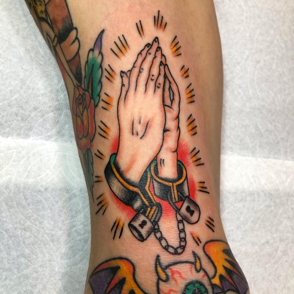 Bound Praying Hands Tattoo with Handcuffs praying hands tattoos tattoo
