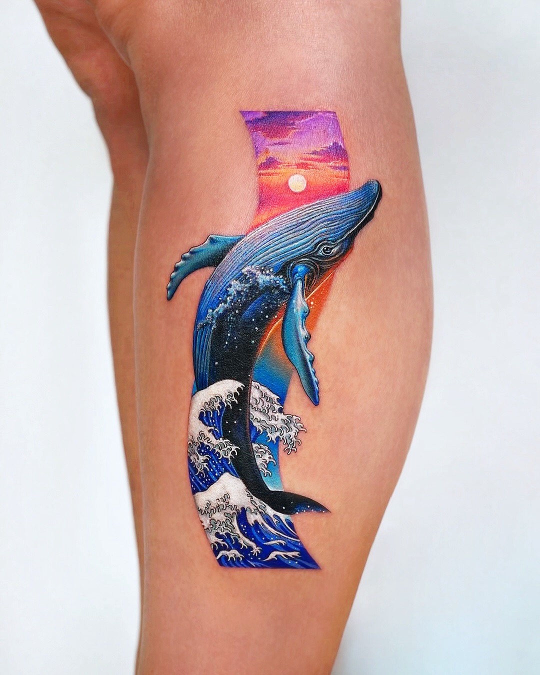 Breaching Whale Beneath Coastal Sunset ocean tattoo