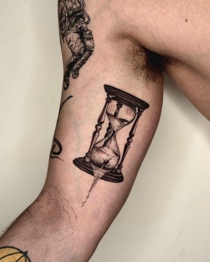 Broken Hourglass Bicep Tattoo hourglass tattoo ideas tattoo