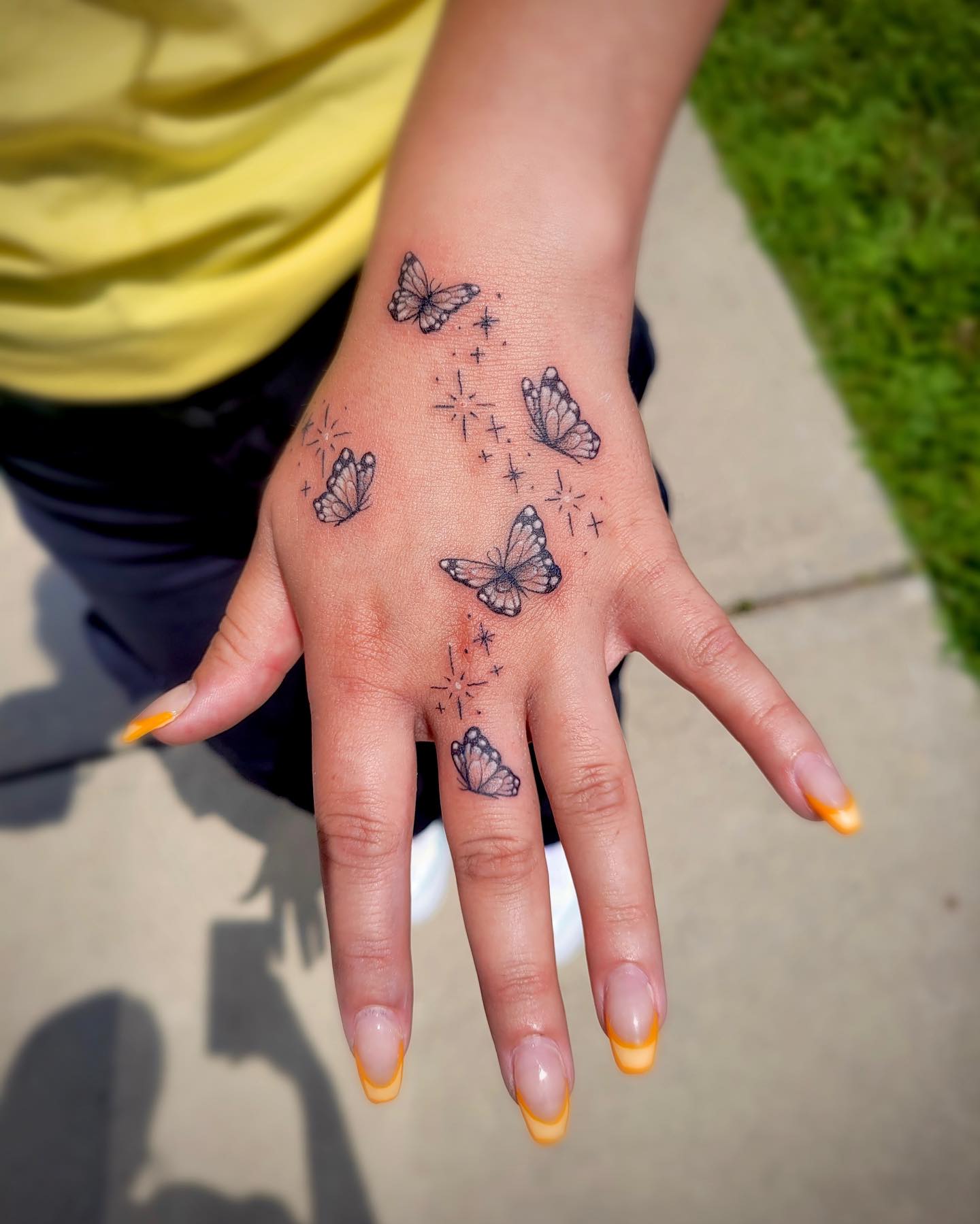 Butterfly And Tiny Hearts Hand Tattoo