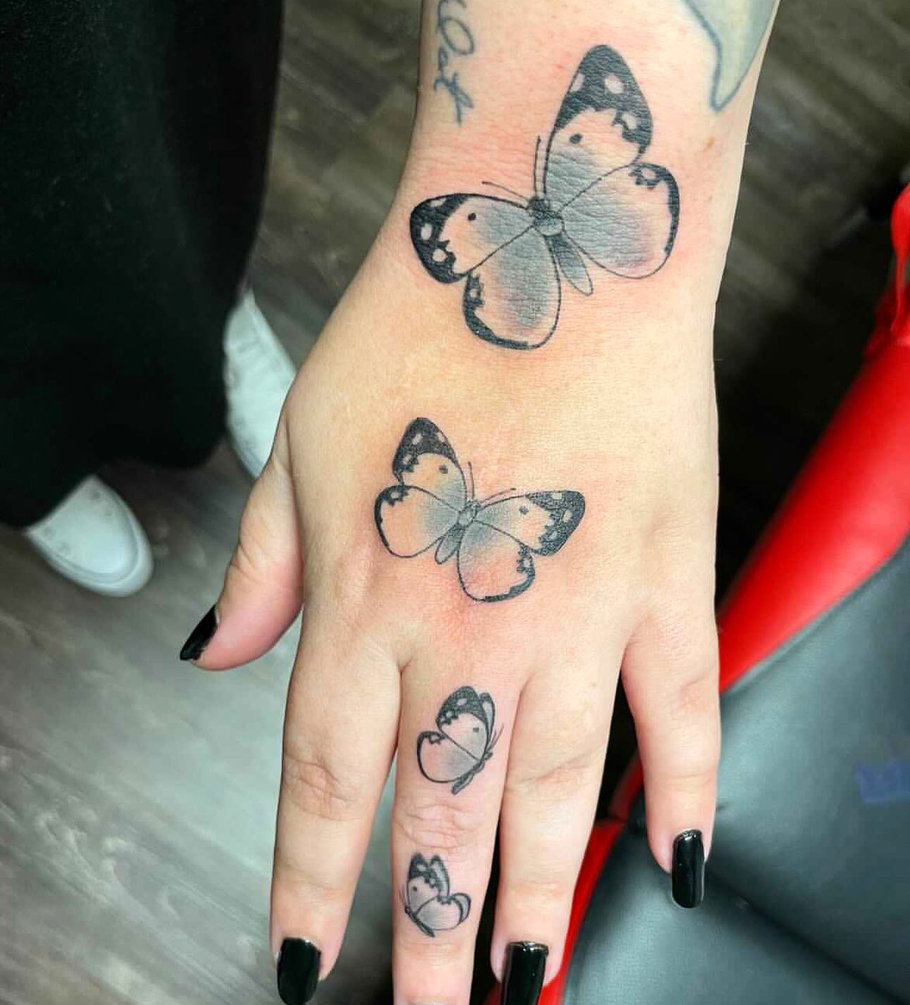Rose And Leaves Hand Tattoo