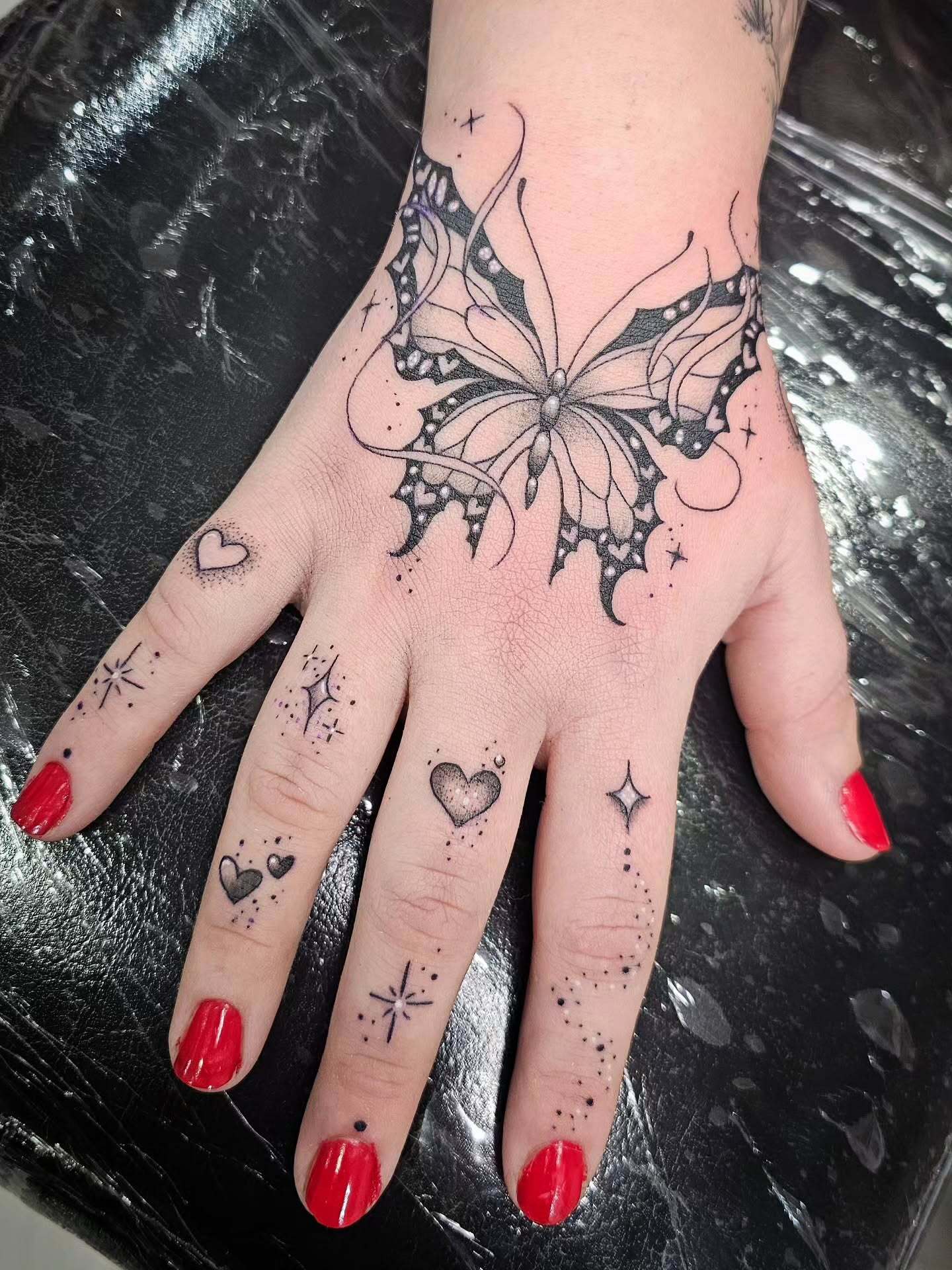 Butterflies And Sparkles Hand Tattoo