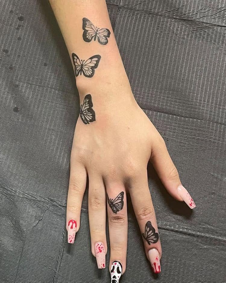 Butterfly Hand and Wrist Tattoo butterfly tattoo designs tattoo
