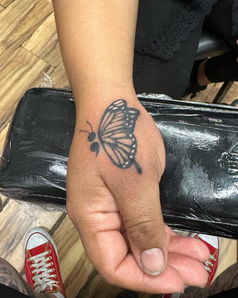 Butterfly Hand Tattoo meaningful semicolon tattoo ideas tattoo