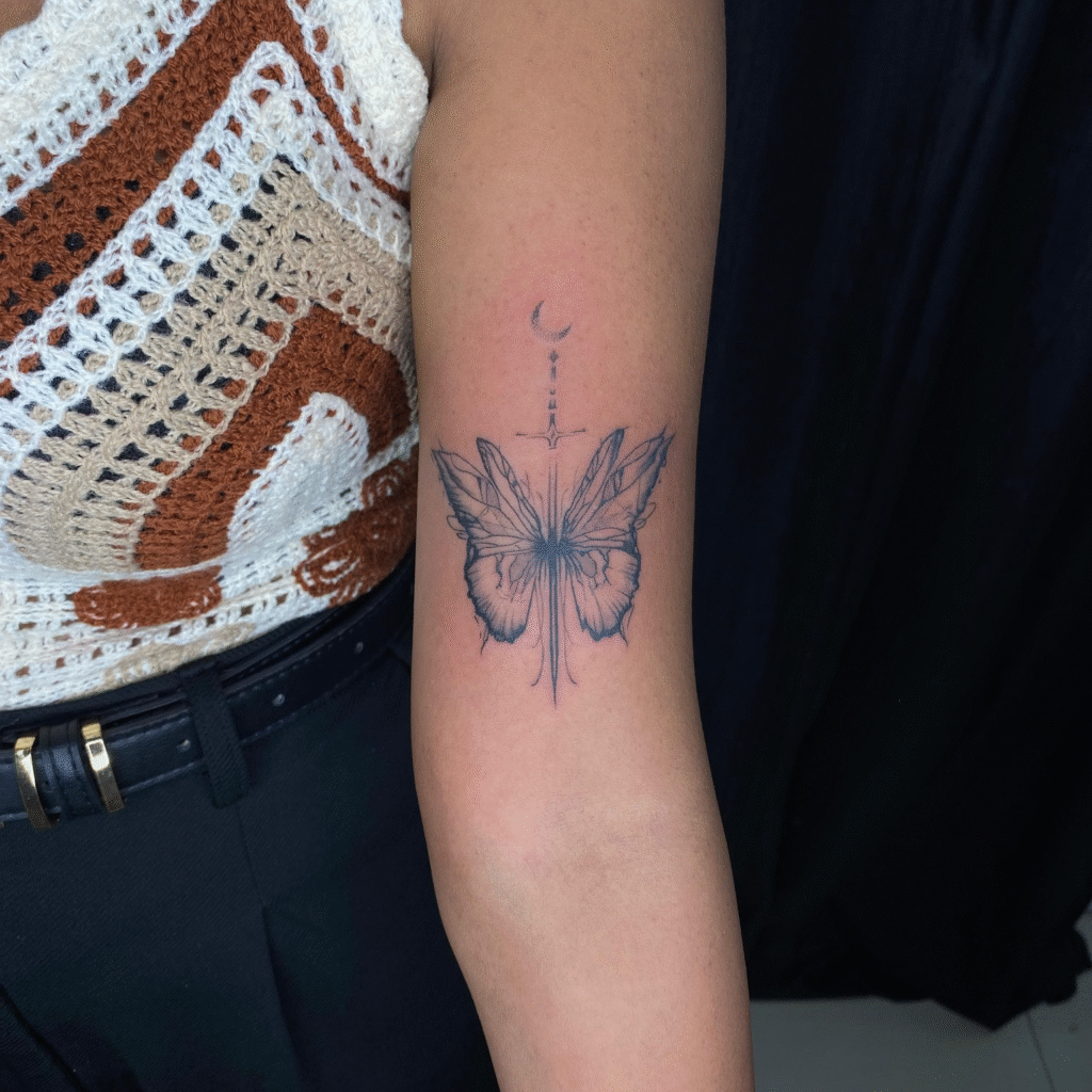Butterfly with Sword and Moon Tattoo butterfly tattoo designs tattoo