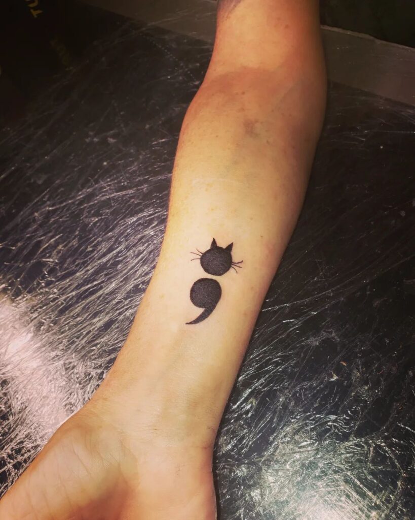 Cat-Themed Semi-Colon Tattoo meaningful semicolon tattoo ideas tattoo