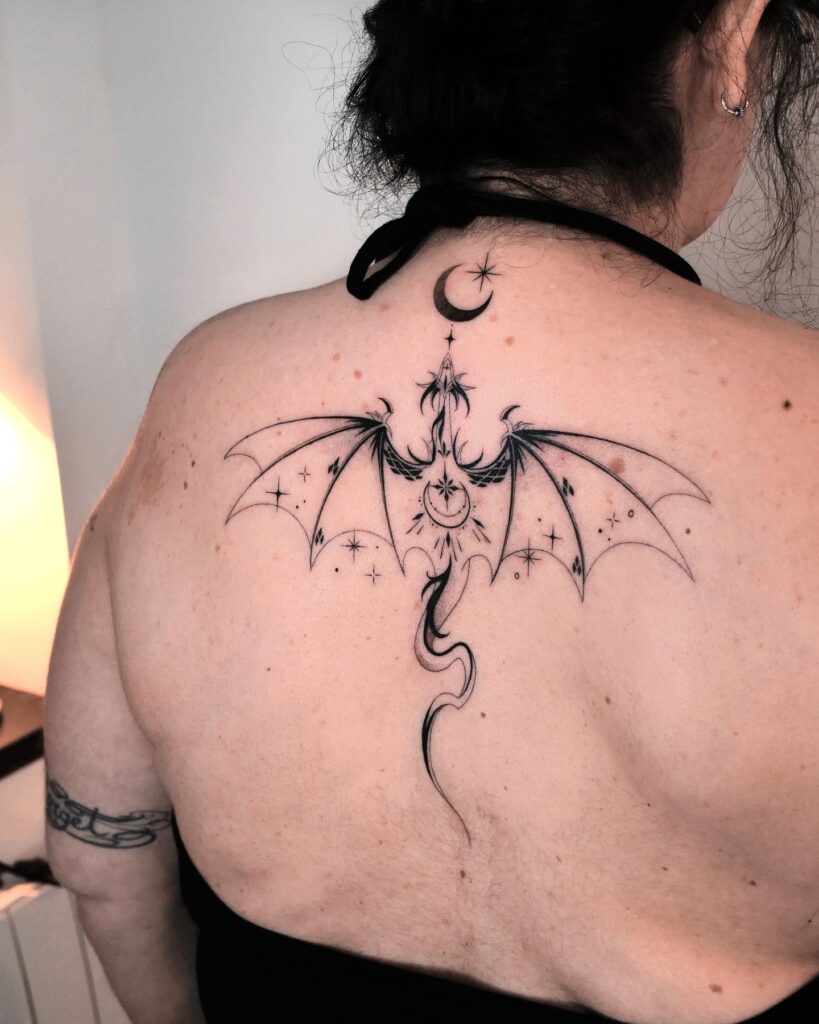 Tiny Flying Dragons With Stars Tattoo
