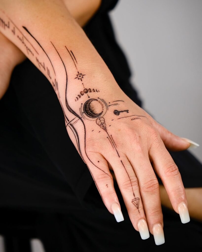 Butterfly And Cosmic Stars Hand Tattoo