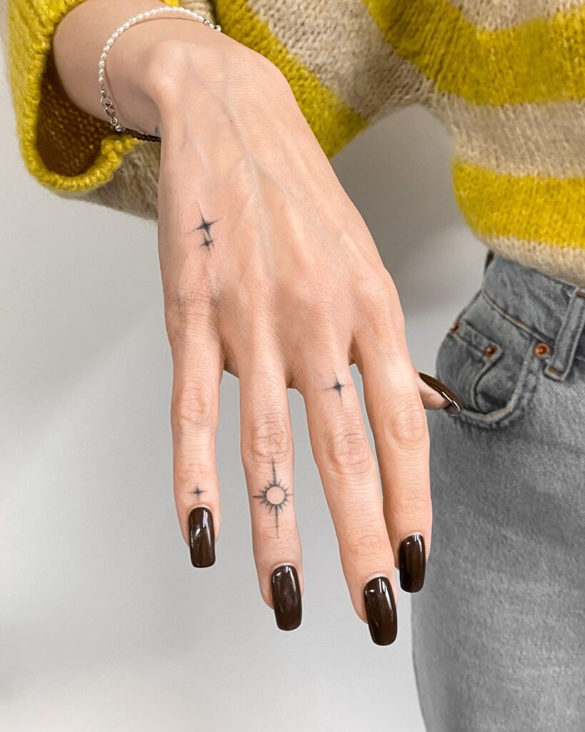 Minimalist Red Snake Finger Tattoo
