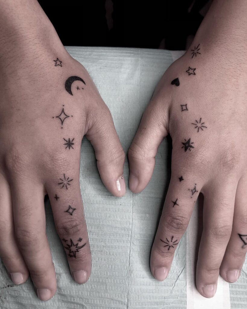 Delicate Butterfly Finger Tattoo