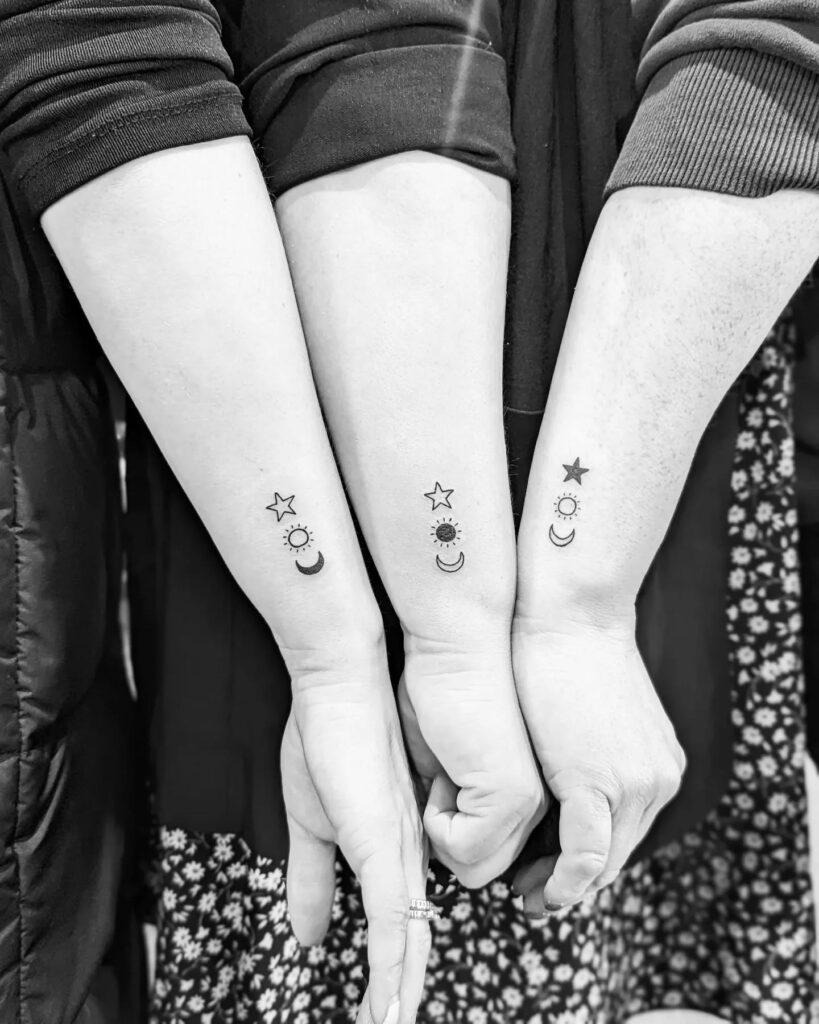 Celestial Sun, Moon, and Star Trio matching family tattoo