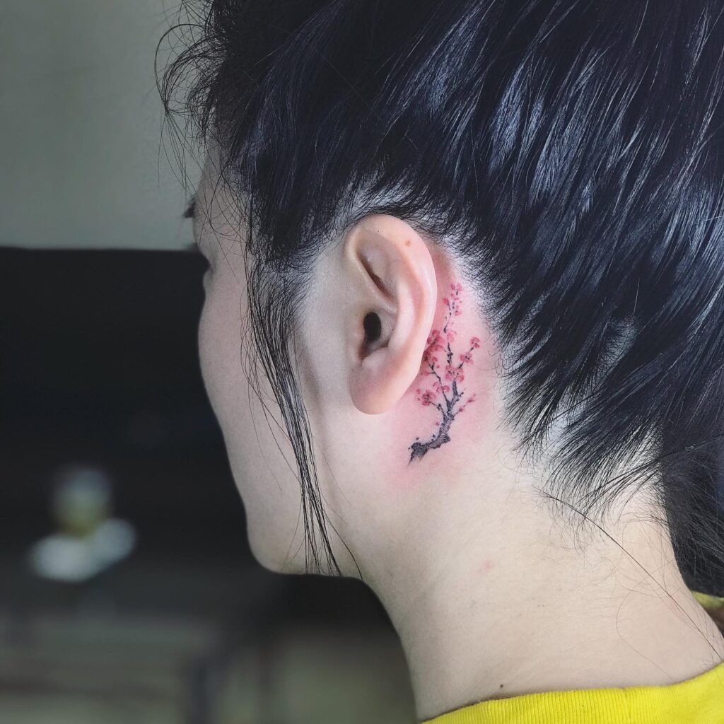 Outlined Rose Behind Ear Tattoo