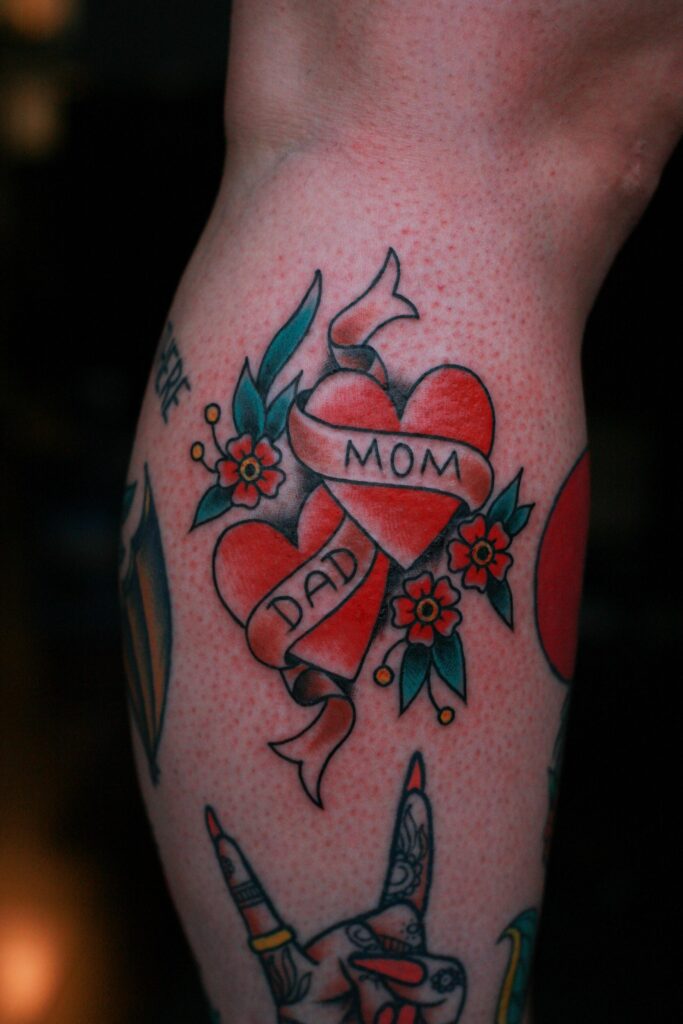 Classic Double Heart Mom Dad Tattoo with Flowers mom dad tattoos tattoo