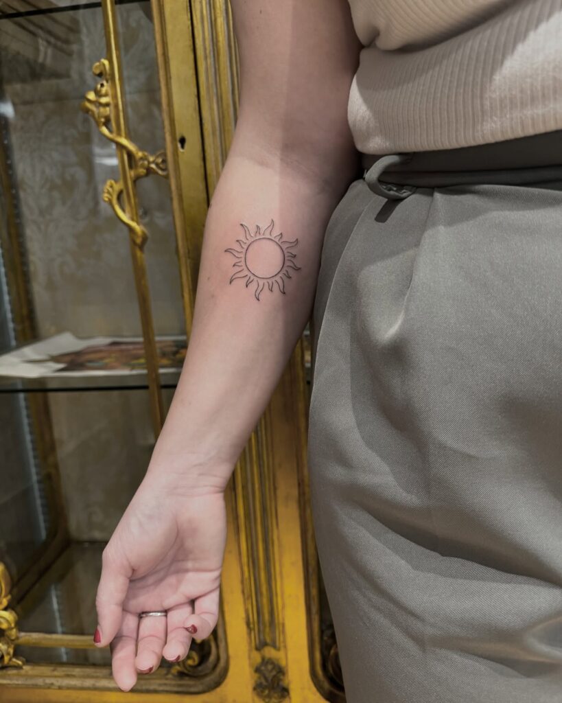 Clean Line Sun Tattoo on Inner Forearm sun tattoos tattoo