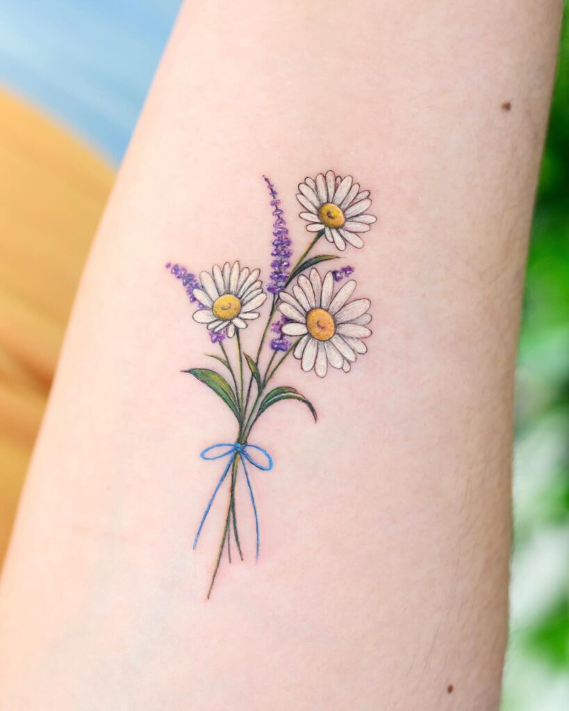 Colorful Daisy Bouquet Tattoo with Ribbon april birth flower tattoo ideas tattoo