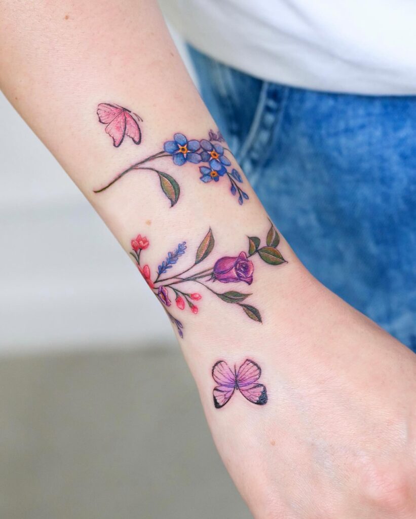 Red Starburst Wrist Tattoo