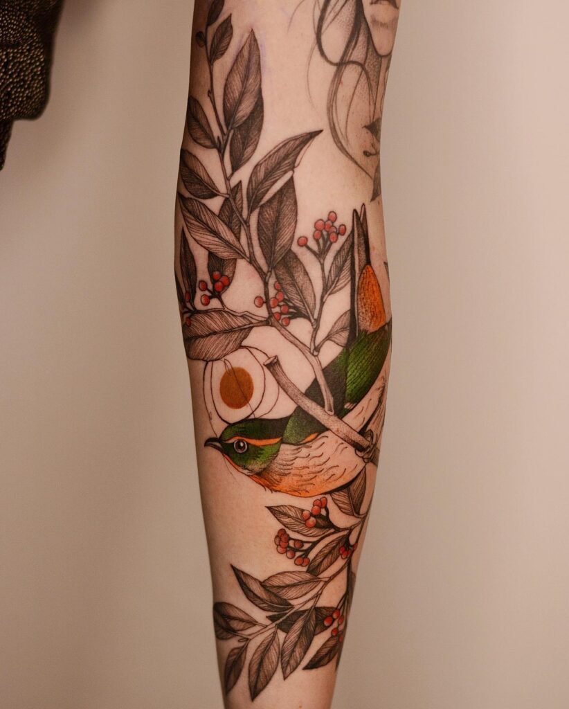 Colorful Forest Bird and Berries Tattoo bird tattoo ideas for women with meaning tattoo
