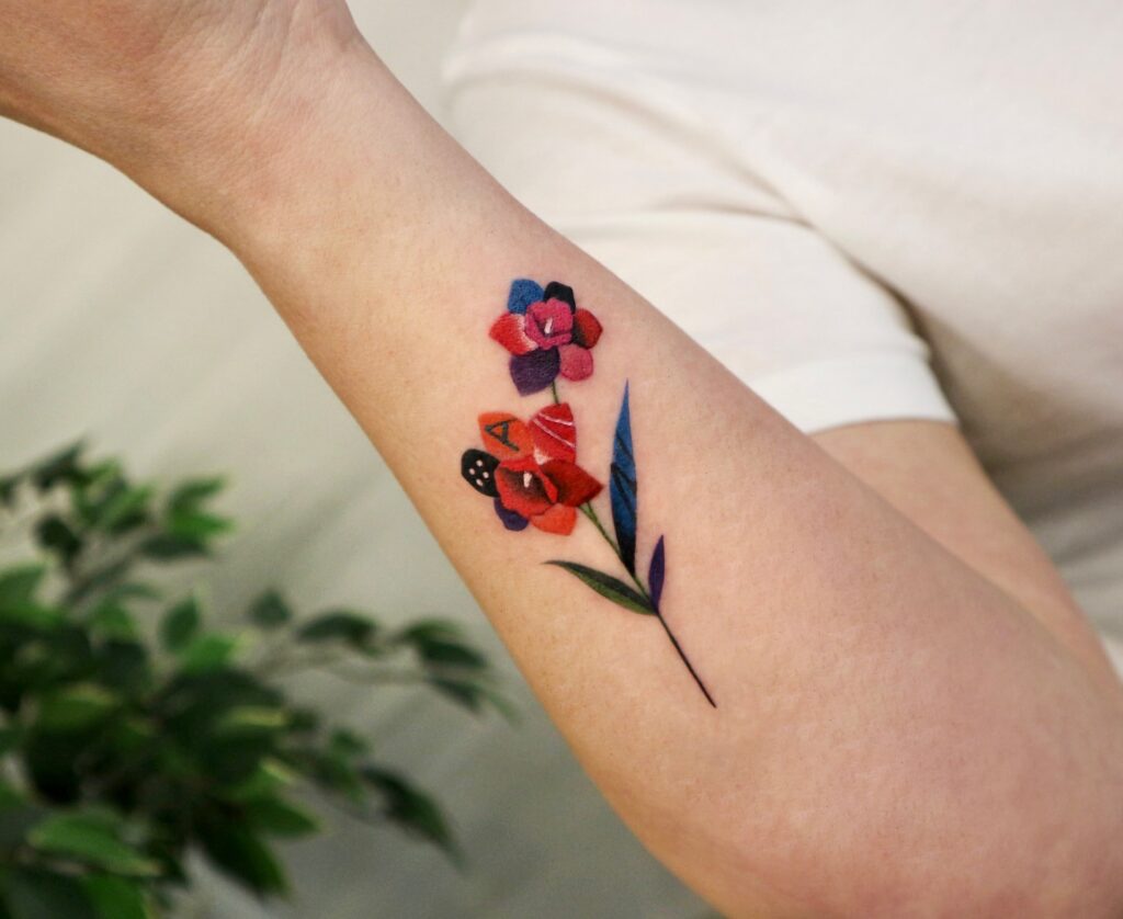 Colorful Patchwork Floral Tattoo in Polyc Style flower wrist tattoo ideas tattoo