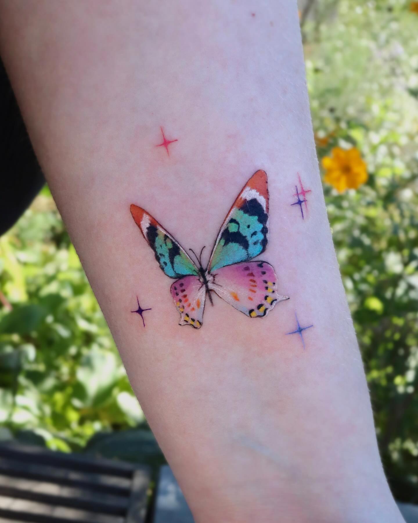 Colorful Sparkle Butterfly Arm Tattoo butterfly tattoos designs tattoo
