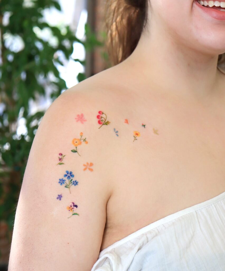 Colorful Wildflower Scatter Shoulder Tattoo women shoulder flower tattoo ideas tattoo