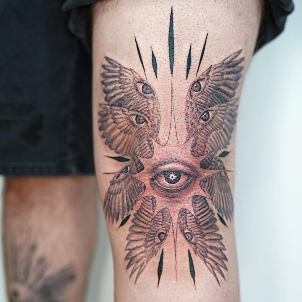Cosmic Seraphim Eye Tattoo with Radiating Wings seraphim angel tattoo ideas tattoo