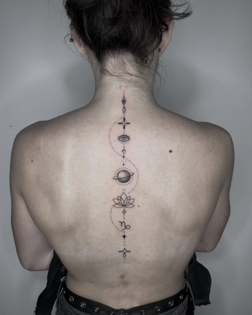 Sacred Lotus Linework Spine Tattoo