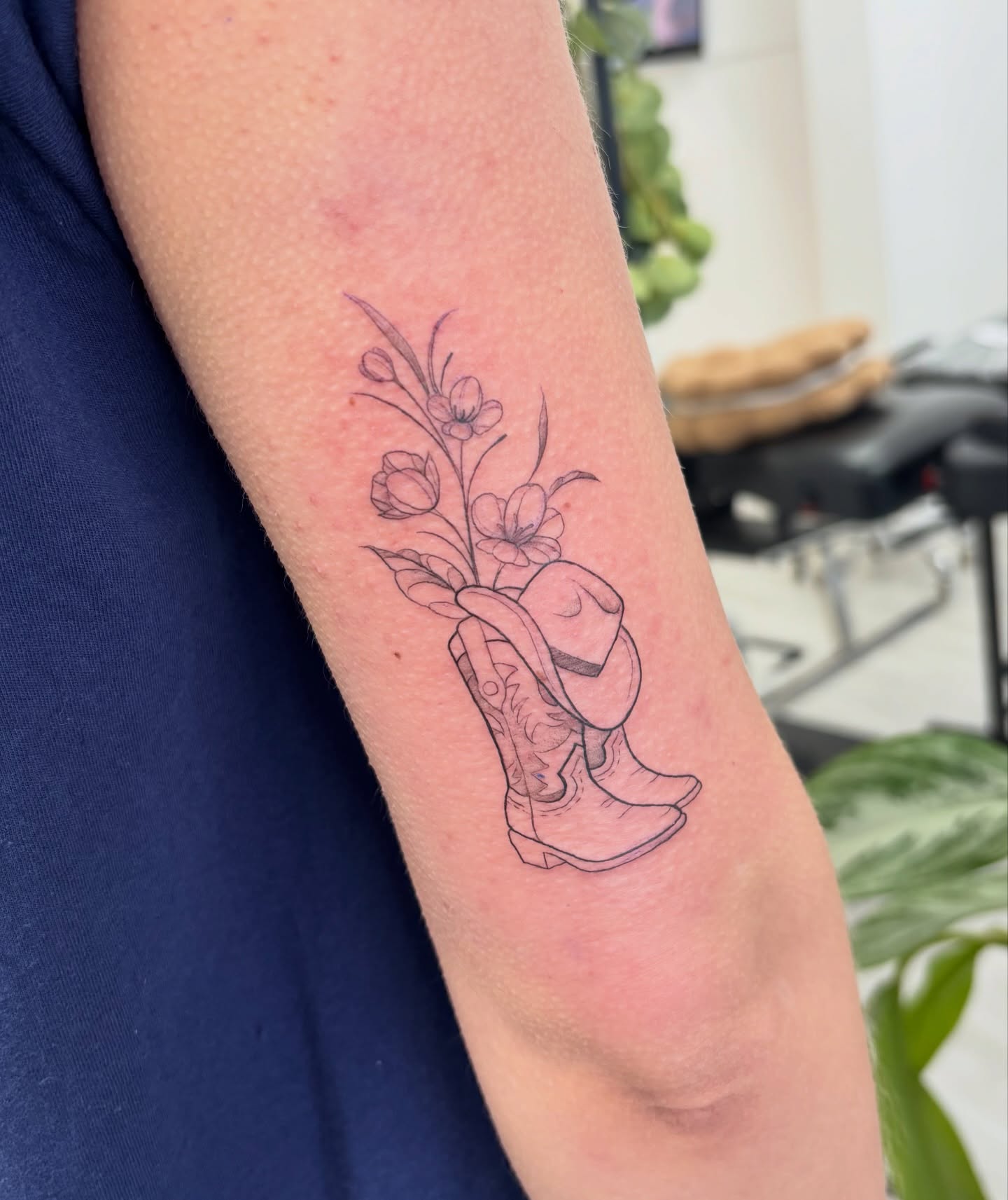 Cowboy Boot and Flowers Fine Line Tattoo fine line tattoo ideas with meaning tattoo