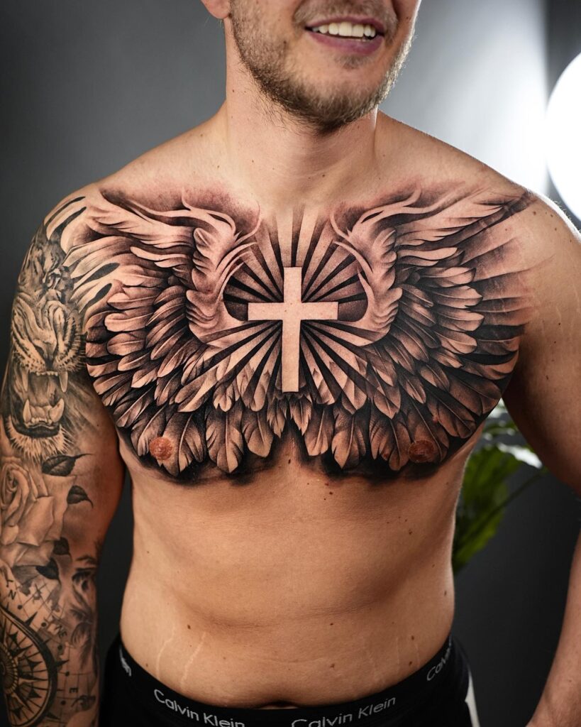 Cross with Angel Wings and Sunray Chest Tattoo cross tattoos for men tattoo