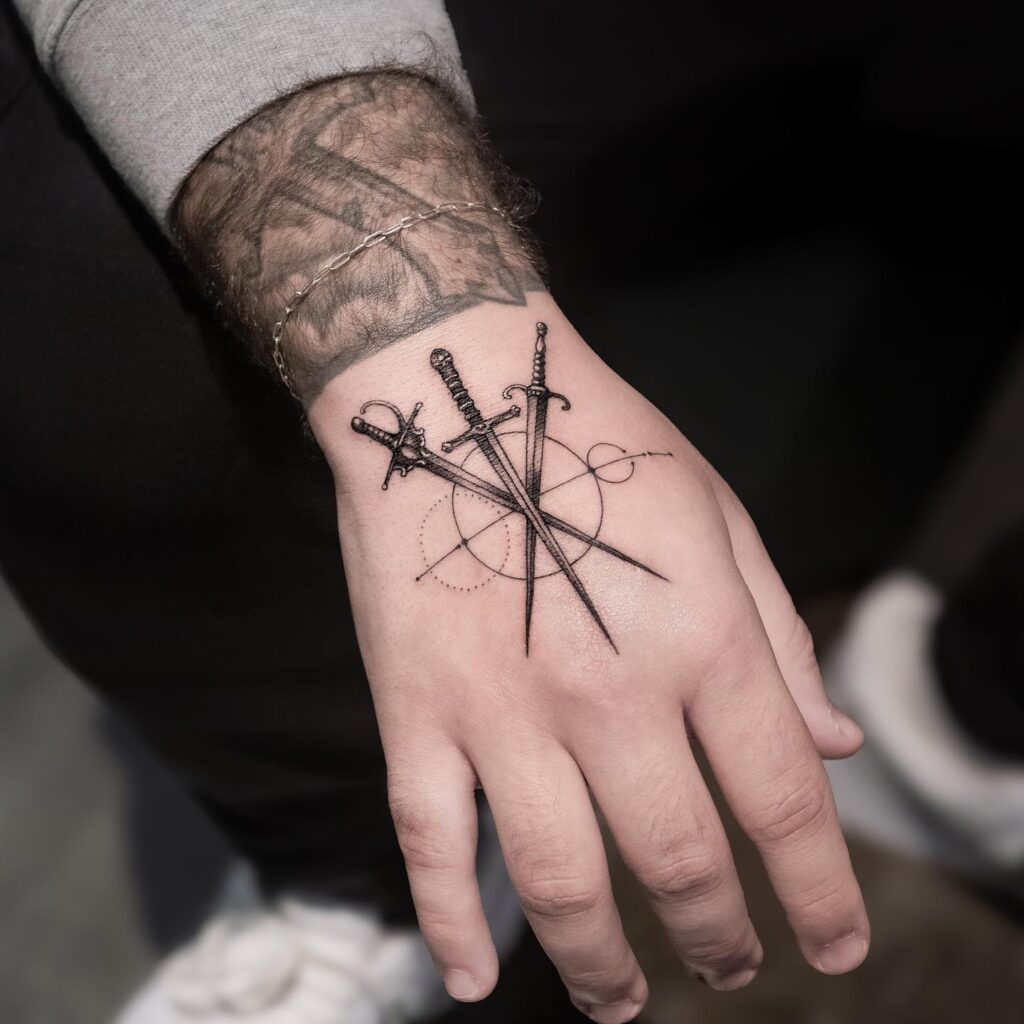 Crossed Swords Geometry Tattoo hand tattoo ideas for guys tattoo