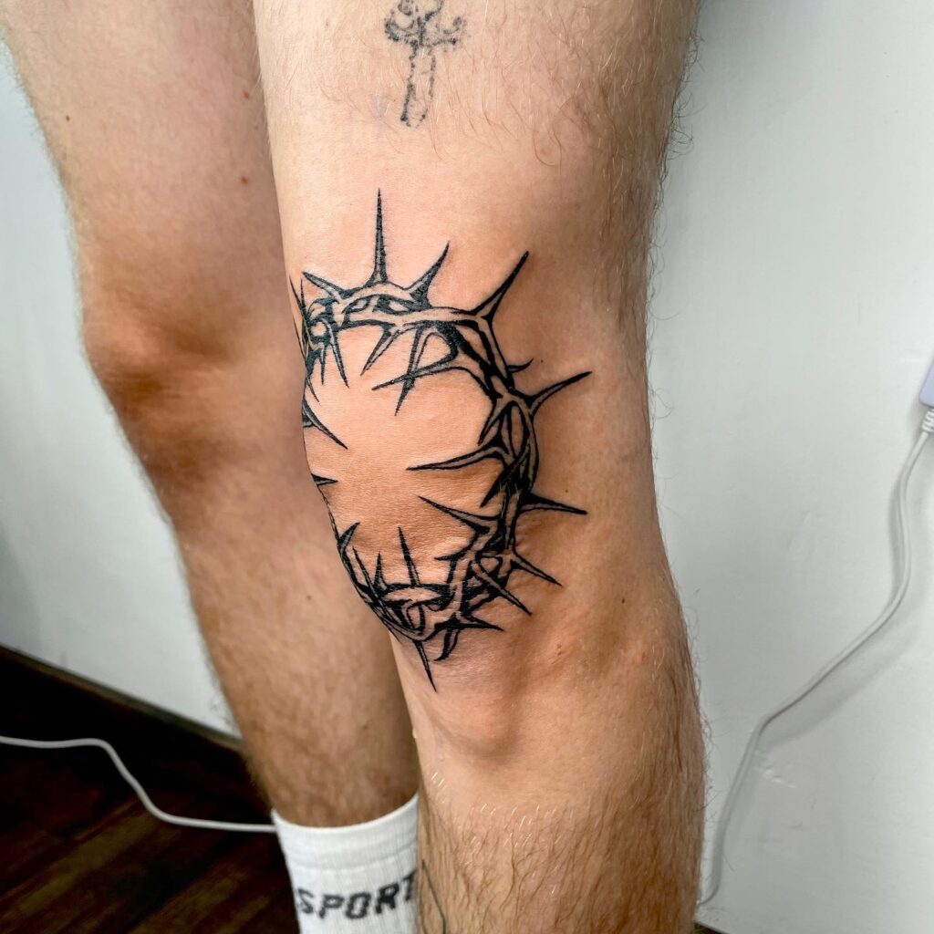 Elegant Floral Wreath Knee Frame Tattoo Design