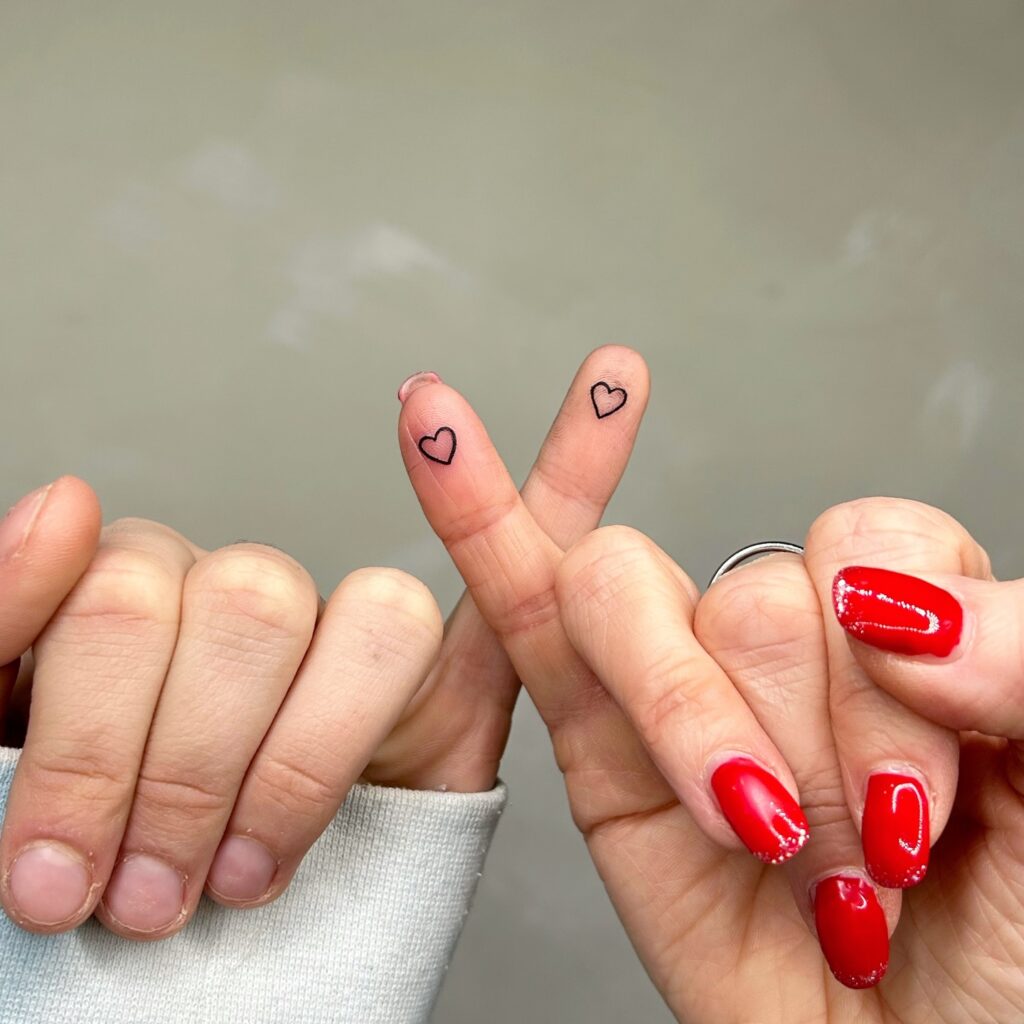 Cursive Family Monogram with Olive Leaves fine line tattoo