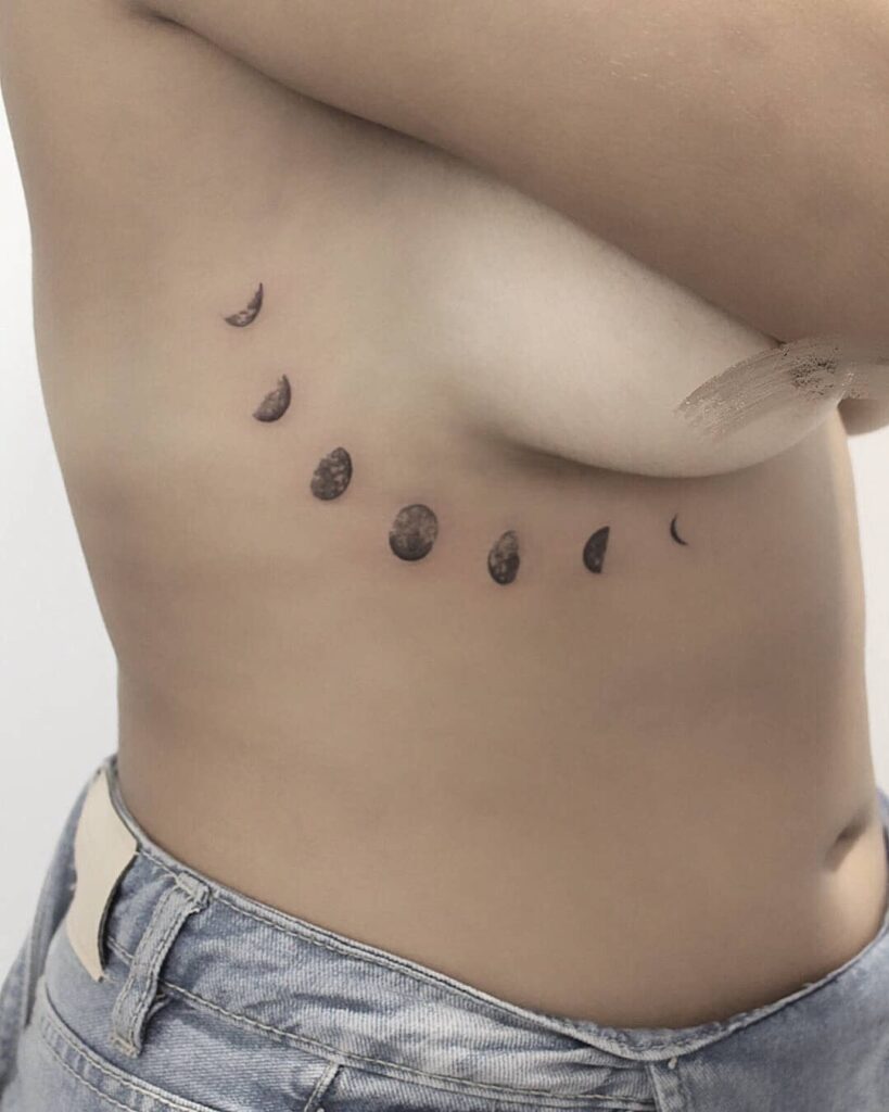 Moon phases underbust tattoo