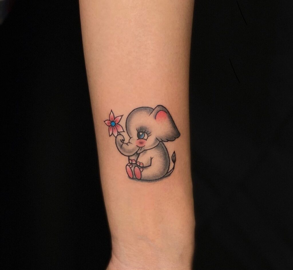 Cute baby elephant tattoo with pink flower