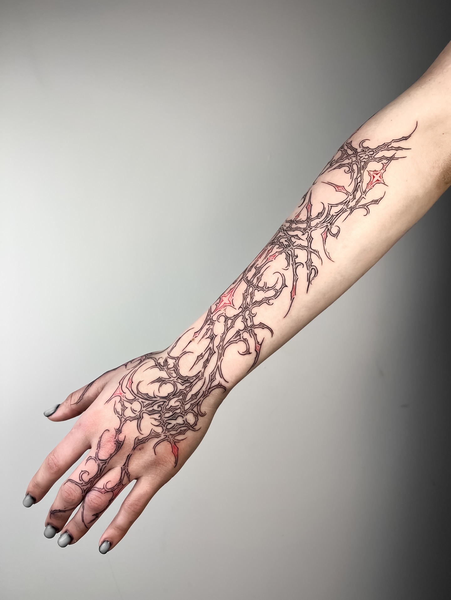 Ornamental Red Accent Cybersigilism Sleeve Tattoo