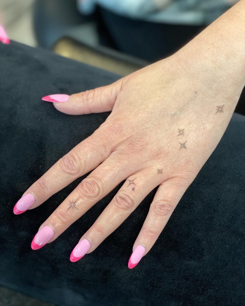 Lightning Bolt And Star Finger Tattoos
