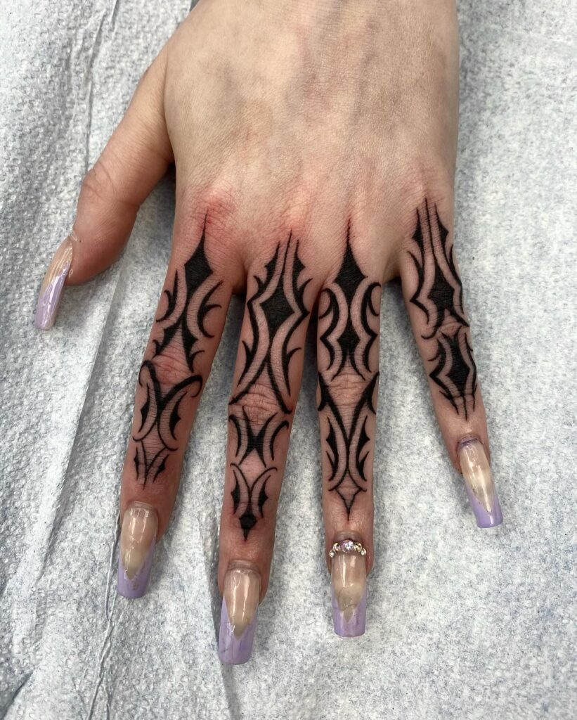 Minimalist Rose Finger Tattoo