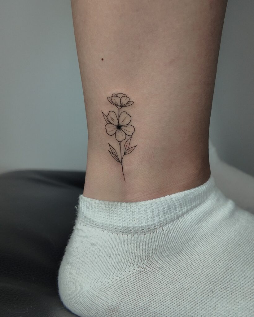 Delicate Botanical Poppy Stem fine line tattoo