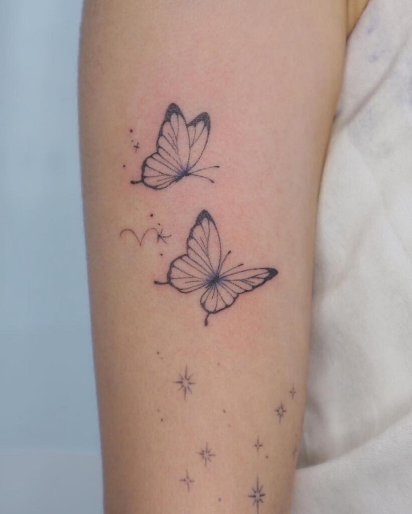 Delicate Butterfly on Lateral Ankle butterfly tattoo
