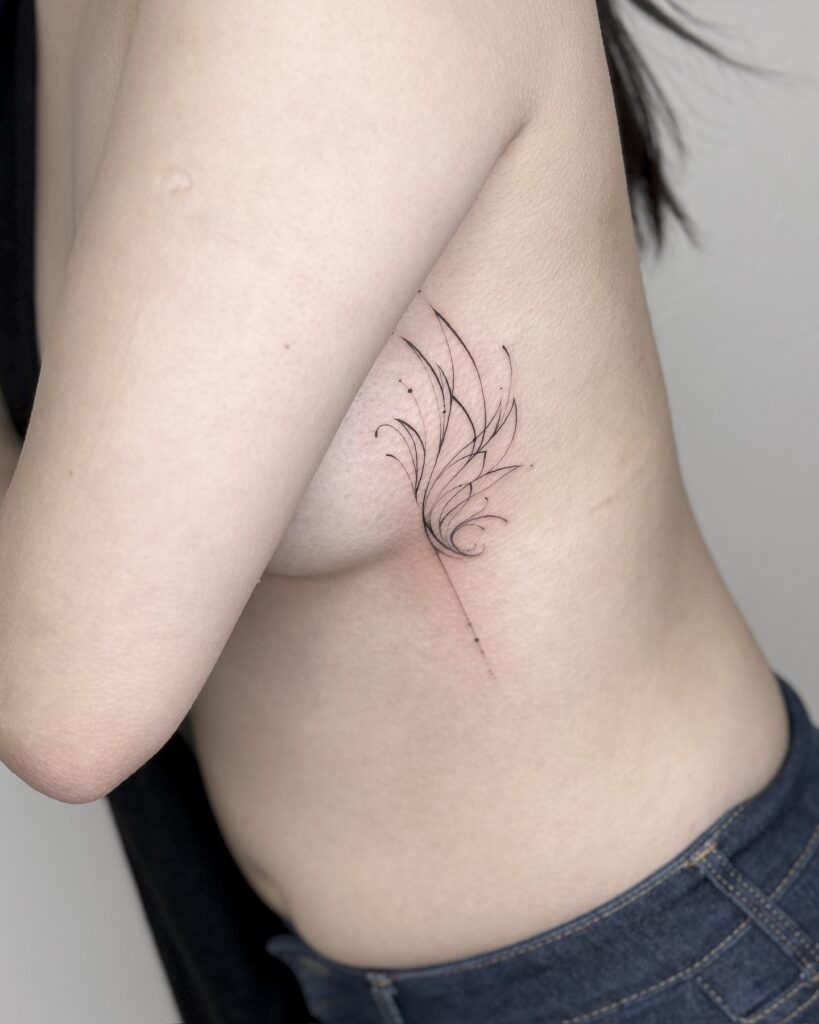 Delicate Fine-Line Angel Wing Underboob Tattoo angel wings tattoo ideas tattoo